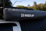 Close-up of the Rigdup logo on the weatherproof PVC cover of the 270 degree awning