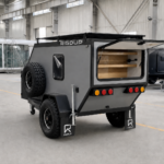 Rigdup off road camper trailer with rear galley hatch open showing storage shelves