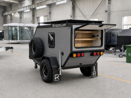 Rigdup off road camper trailer with rear galley hatch open showing storage shelves